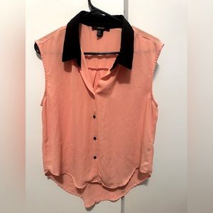 Peach sleeveless shirt with black collar